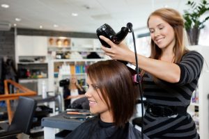 hairstylist doing a blowout